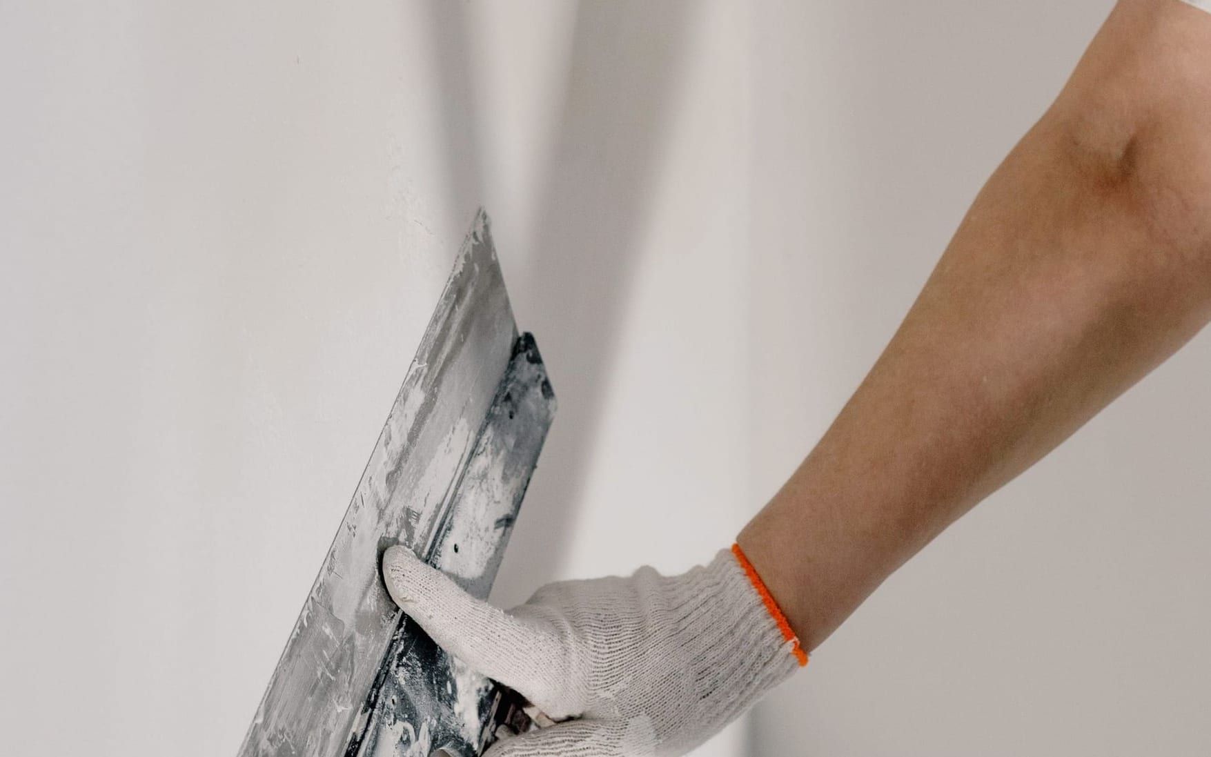Troweling texture onto a repaired section of drywall