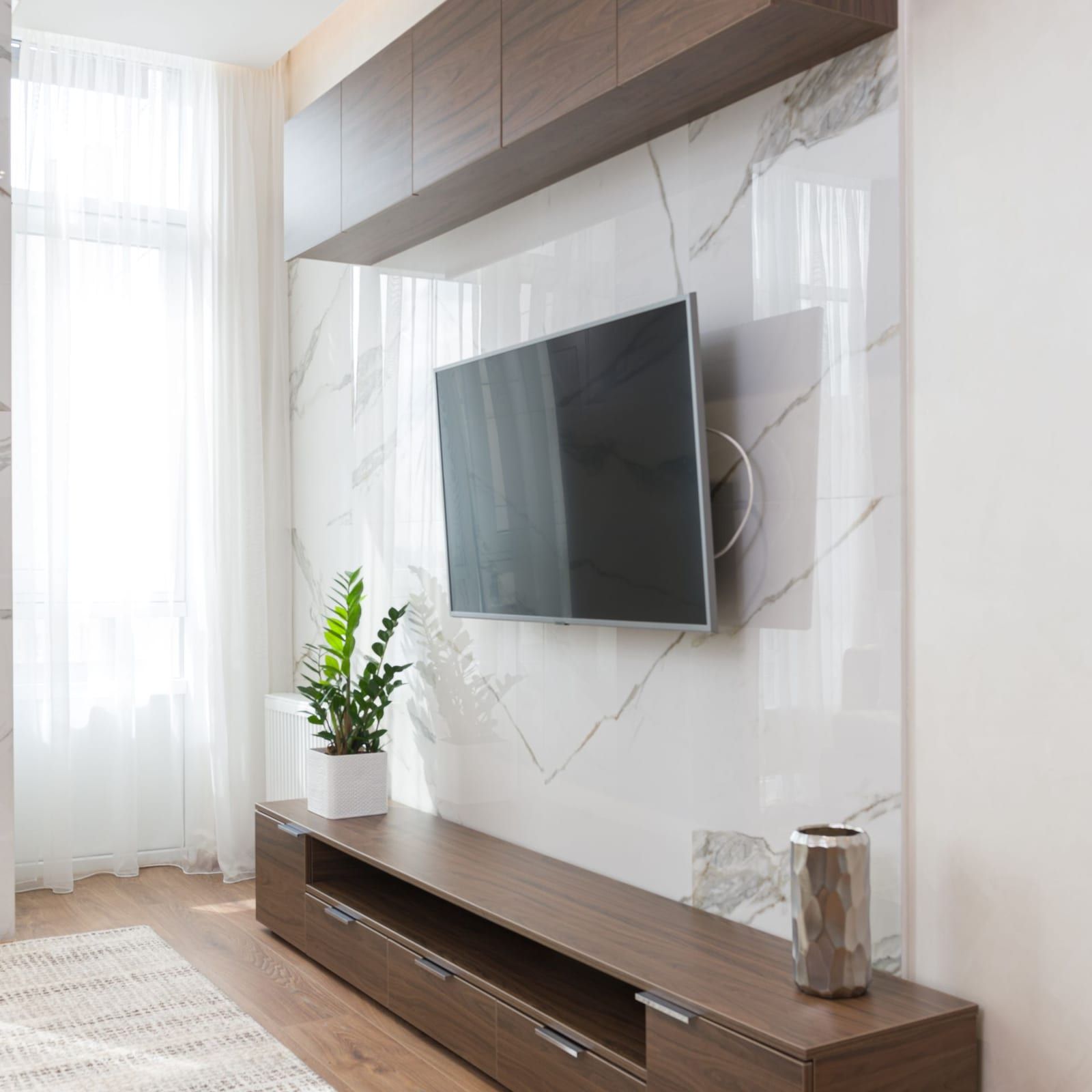 Television on a finished media wall with every cable hidden behind it
